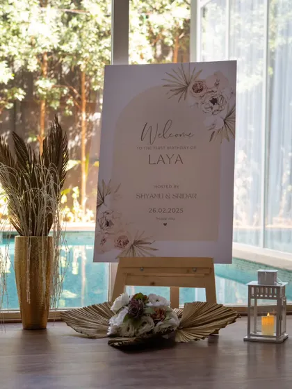 A welcome sign for a minimalist first birthday. The elegant script and simple design set a chic tone for the celebration.