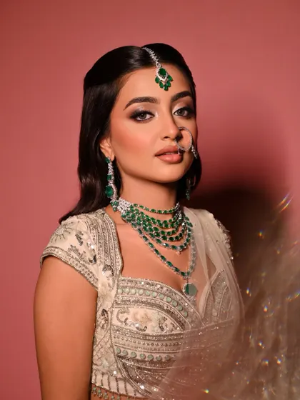 This image, with a touch of motion blur, captures the ethereal and dreamy quality of the "Moonlit Majesty" bridal look.