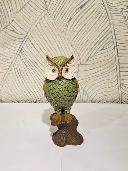 A green version of our classic perched owl figurine. The earthy color makes it a great fit for homes with a nature-inspired decor theme.