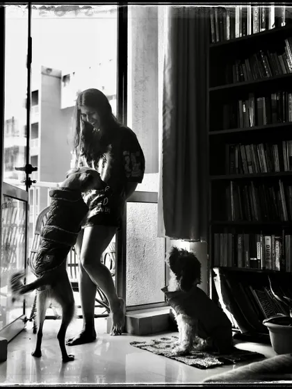 Sara and her dogs, a moment of pure joy and chaos. This 'Doorways' photo is a testament to the love we share with our animal companions.