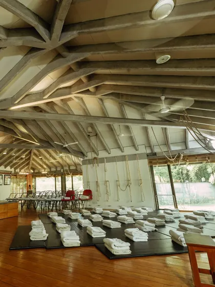 The main hall at Yogakshema, prepared for a class. The space is open, airy, and filled with a sense of calm, ready to welcome students.
