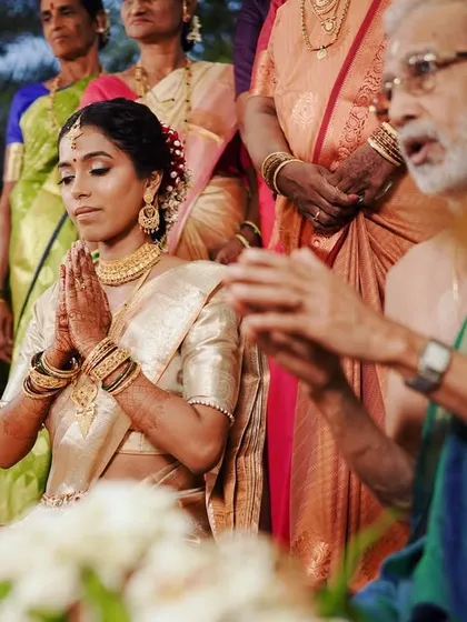 Bride Preeti during her wedding puja. The pre-pleated saree ensures she remains comfortable throughout the long ceremonies.