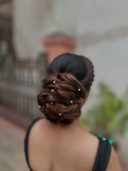 A detailed back view of the pearl-adorned bun.