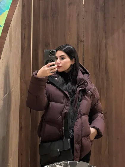 A mirror selfie in a cozy puffer jacket, part of a "bits and pieces" photo dump.