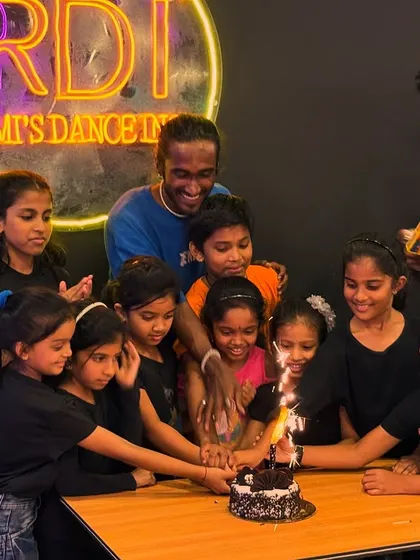 Another angle of our team cake-cutting effort. It shows the collaborative and fun spirit that we encourage in all our activities.