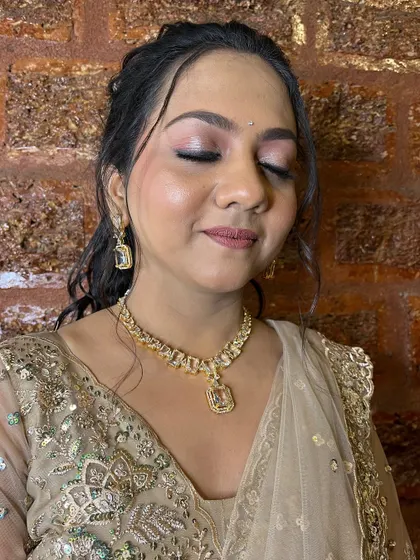 A close-up of the sangeet eye makeup, featuring soft pink tones and a dewy finish on the skin.