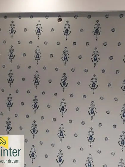 The same repeating damask pattern, showcasing the precision required to ensure the design is perfectly aligned across the wall.