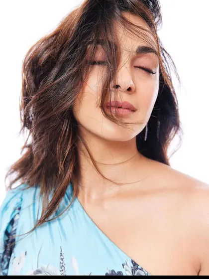 An intimate, expressive shot of Kiara Advani from the Stayfree campaign. Even in a simple portrait, the styling of the one-shoulder dress and soft hair contributes to the overall mood of gentle confidence.