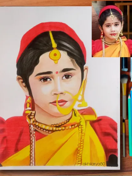 A beautiful portrait of a little girl in traditional Uttarakhand attire. This A4 colored pencil drawing is rich with cultural detail, from her nose ring to her red cap.
