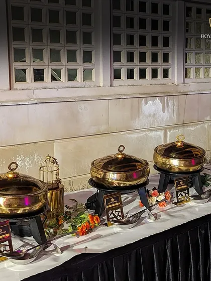 A clean and elegant buffet setup with my signature brass chafing dishes. I ensure the presentation is always impeccable, allowing you to focus on your guests and create memories.