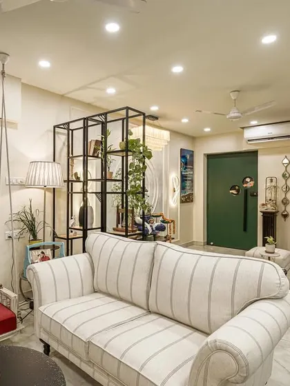 Another angle of the living room from image 22, highlighting the striped sofa and swing.