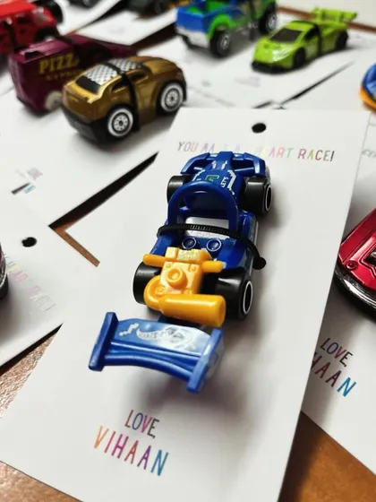 A close-up of one of the awesome Hot Wheels party favors, a cool blue race car ready for action.