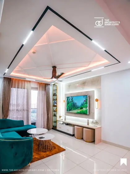 A duplicate image of the modern living room, offering another perspective on the ceiling design and TV wall.