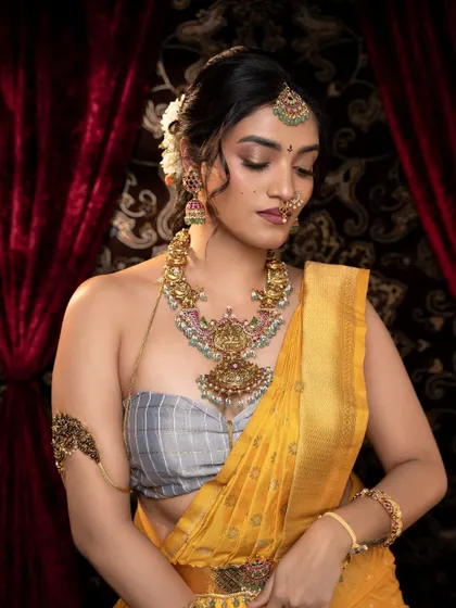 A close-up view focusing on the stunning pendant of the necklace, a centerpiece of the entire look.
