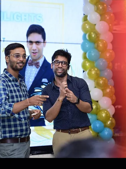 Working with a volunteer from the audience at the Capitaland event. I make sure my volunteers feel comfortable and have a great time being part of the magic.