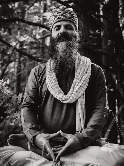 Shift your energy from worrying about what you cannot control to focusing on what you can create. This black and white photo captures a moment of deep meditation, where creation begins.