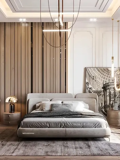 A luxurious bedroom featuring a mix of textures, including a wood-paneled accent wall, mirrored surfaces, and classic wall molding. The statement chandelier adds a touch of glamour.