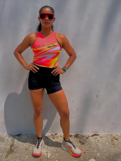 "Some fear the fire, some become it." A powerful stance before a run. This captures the confidence that comes from dedicated training. My goal is to empower every athlete I work with to feel this strong.