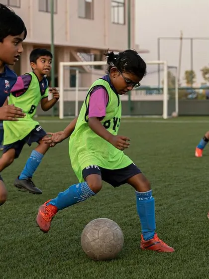 Haridra in action, dribbling the ball with determination. We wish her all the best.