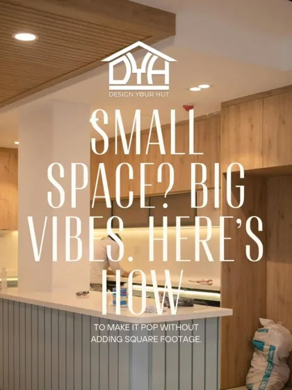 Small space? Big vibes. This image of a compact kitchen with a breakfast bar shows how to make a small area pop without adding square footage. It's all about a smart layout, light colors, and creating zones for different functions.
