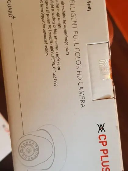 A side view of a CP Plus camera box, showing the "Intelligent Full Color HD Camera" description.