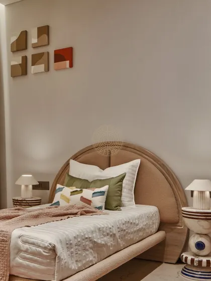 For the kids' bedroom, we designed this custom bedside table with a unique geometric design of stacked shapes. It’s a playful touch that is both fun and functional.