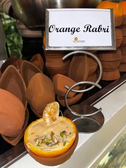 A refreshing twist on a classic. Our Orange Rabri is served inside a hollowed-out orange, infusing the rich, creamy rabri with a zesty, citrusy aroma.