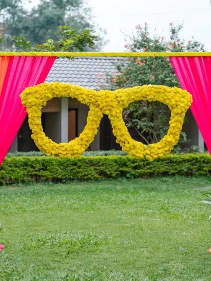 Fun and quirky decor elements like these oversized floral sunglasses make for great photo opportunities and add a playful touch to any Haldi celebration.