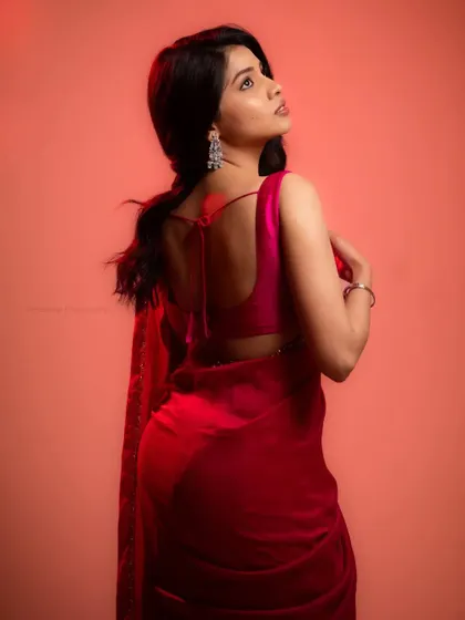 Another shot with creative red lighting, this time from the back. This creates a beautiful silhouette and highlights the model's form.