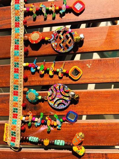Close-up on the playful elements of the 'Rang-Tarang' toran. I use a mix of wooden, glass, and ceramic beads to create texture and interest.