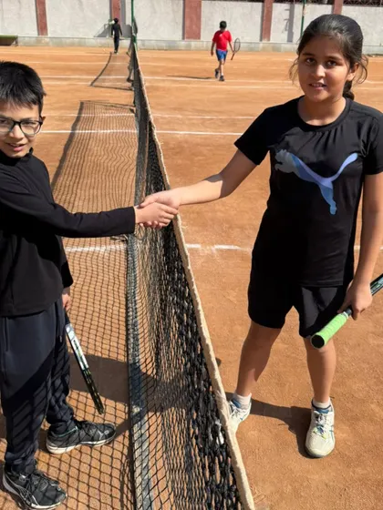 A handshake between competitors at our internal tournament. We teach our players to respect their opponents, win or lose.
