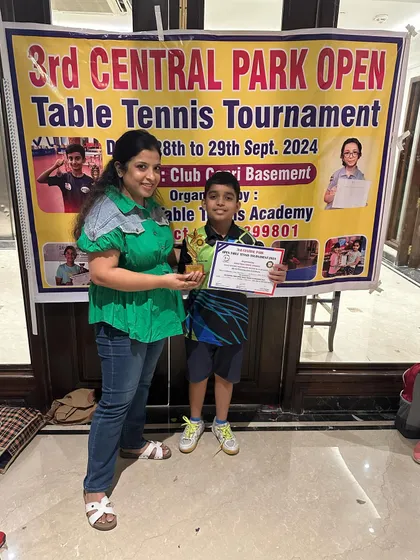 A young champion from our academy with his trophy and certificate at the 3rd Central Park Open Table Tennis Tournament. Hard work truly pays off.
