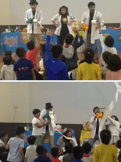 Audience participation is key to our shows. We love bringing kids on stage to help with experiments, like this air pressure demonstration using a leaf blower and toilet paper, which always ends in laughter.