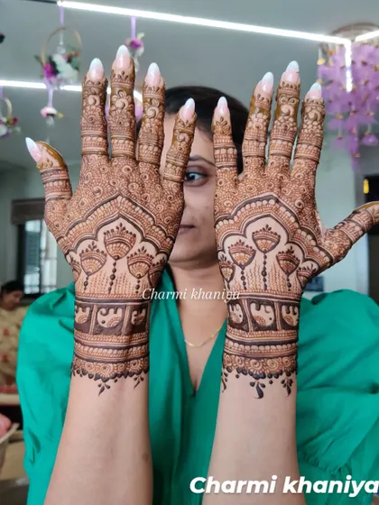 Mehendi Love! A beautiful design with hanging jhumkis and elephant motifs, perfect for a wedding celebration.