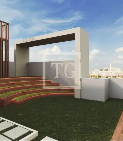 This render for the Goregaon project showcases a unique stepped amphitheater-style seating area integrated with green turf, perfect for gatherings.