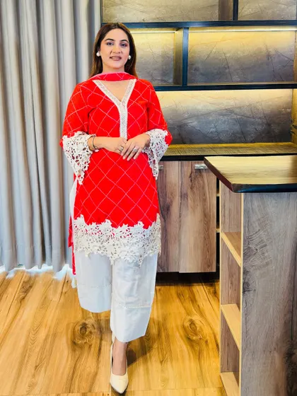 This red suit is a great example of how to blend festivity with grace. The minimal printed dupatta with tassels adds just the right amount of charm without overpowering the elegant kurta.