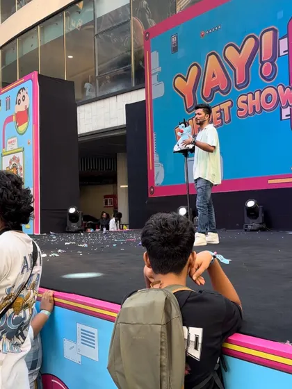 A shot from the side of the stage during the Sony Yay event at R City Mall. You can see the large setup and the engaged audience.