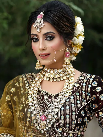 This bridal set features beautiful pink stones, offering a softer alternative to traditional red or green. It's a popular rental choice for pastel-themed weddings.