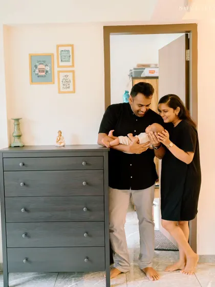 A candid moment at home with a new baby. In-home sessions are a wonderful way to capture your new life in your own comfortable space.