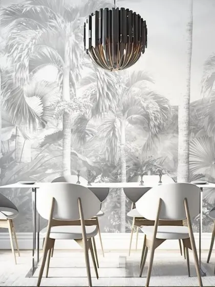 A beautiful grayscale mural of a tropical forest with towering palm trees. The monochrome palette gives this dining room a timeless and sophisticated feel, emphasizing the beauty of the natural forms.