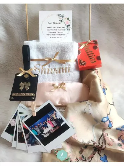 A sweet farewell hamper for a departing colleague. We included a personalized towel and luggage tag, a beautiful scarf, and a string of polaroid photos to remind them of their time with the team.