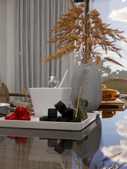 A close-up of the dining table styling, with dried pampas grass and simple tableware reflecting the natural, minimalist theme.