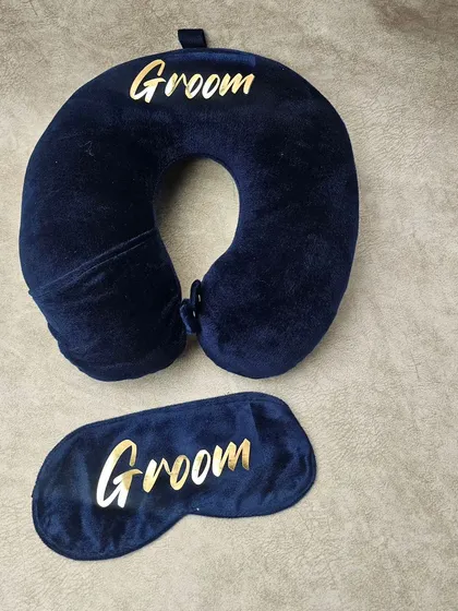 Travel in comfort with this personalized neck pillow and eye mask set. Made from plush velvet fabric, both items can be customized with 'Groom', 'Bride', or any name for a luxurious travel experience.