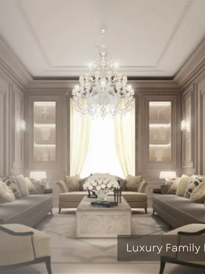 An opulent family lounge designed for luxury and comfort. The space features classic wall molding, plush sofas, and a stunning crystal chandelier, creating a timeless and elegant gathering area.