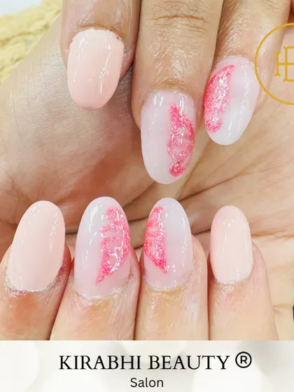 A different view of the delicate pink glitter feather design, showing the full set.