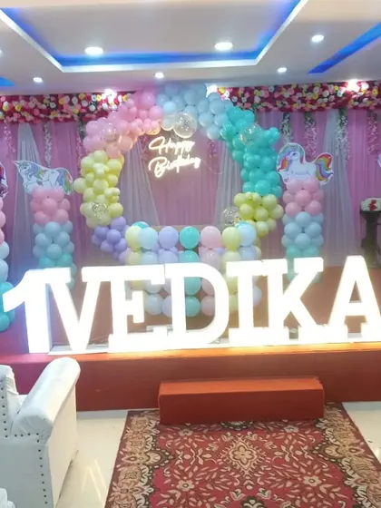 A dreamy Unicorn theme for Vedika's first birthday stage. I used a pastel rainbow balloon arch, unicorn cutouts, and a glowing neon sign to bring this magical world to life. This is one of the most requested themes for little girls.