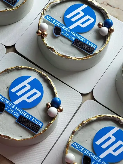An example of a bulk corporate order of mini cakes for HP. Each cake features the company logo and branding, designed with a clean, elegant aesthetic perfect for celebrating team achievements or corporate events.
