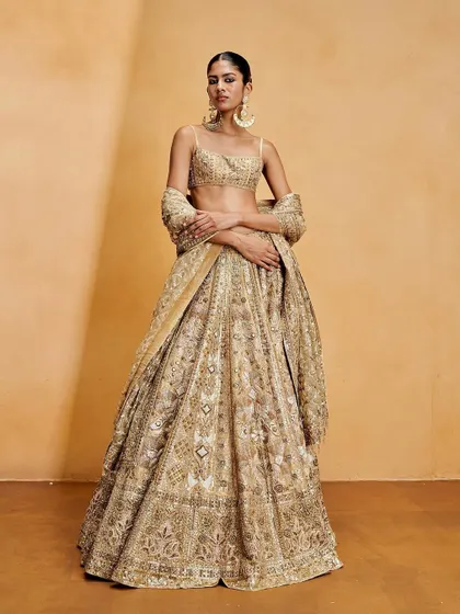 For this Anita Dongre shoot, we created a super clean, snatched bun in the shape of the number "8" to complement the reverse smokey eyeliner.