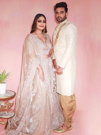 Couples that rent together, save together. This pair looks stunning in their coordinated pastel outfits, perfect for an engagement or reception.