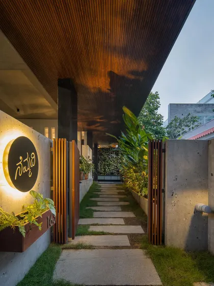 A duplicate image of the entrance pathway at dusk.